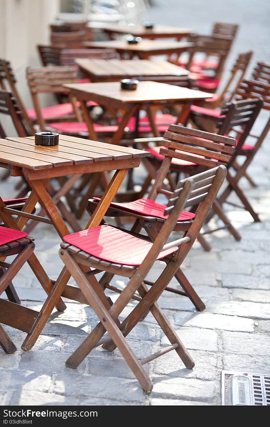 Empty tables in street cafe