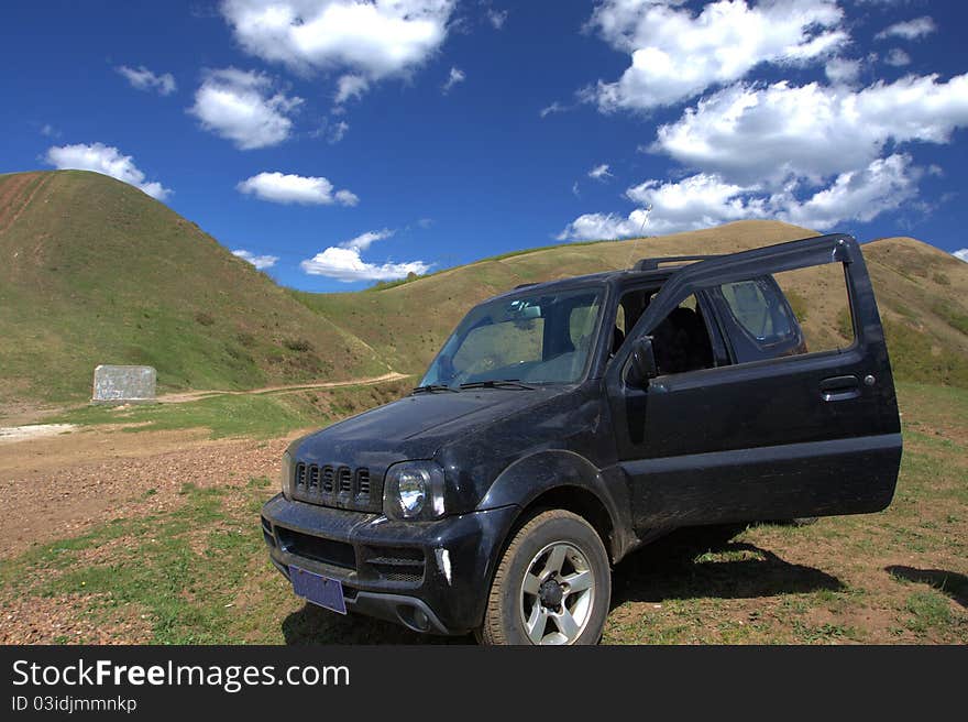 A SUV in the mountain. A SUV in the mountain