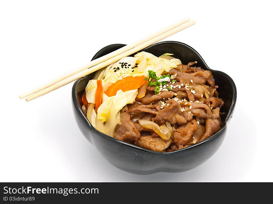 Rice under fried pork and vegetable on white background