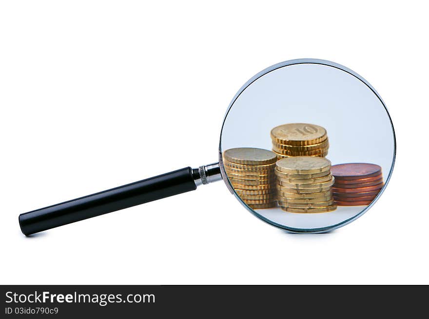 Magnifier and stack of coins.