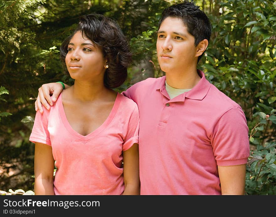 Hispanic boy hugging African American girl. Hispanic boy hugging African American girl