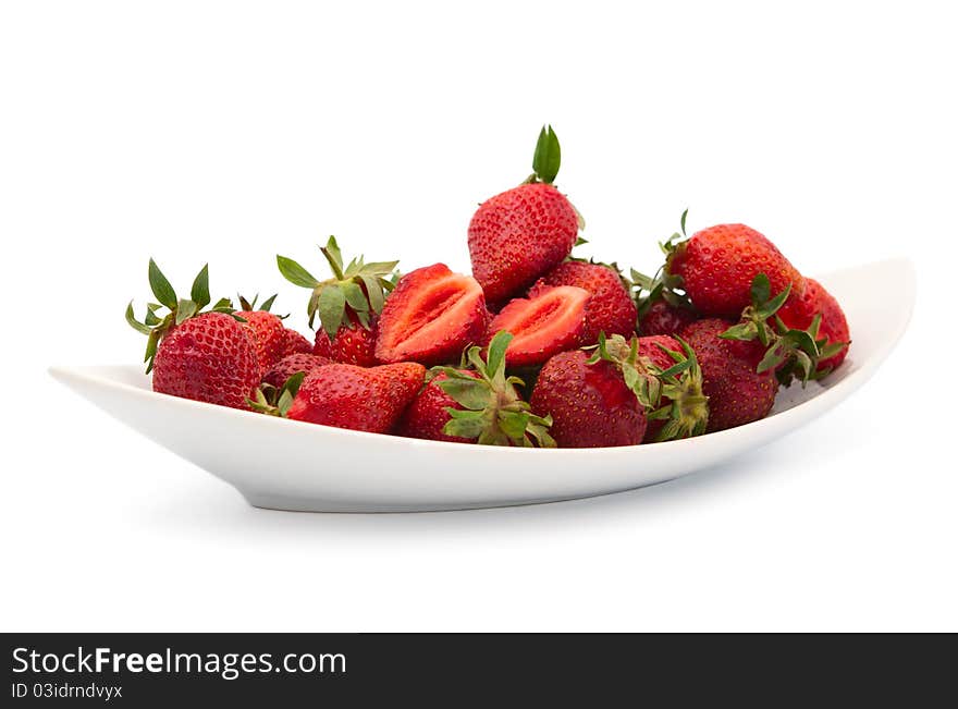 Strawberries in a dish on a white background