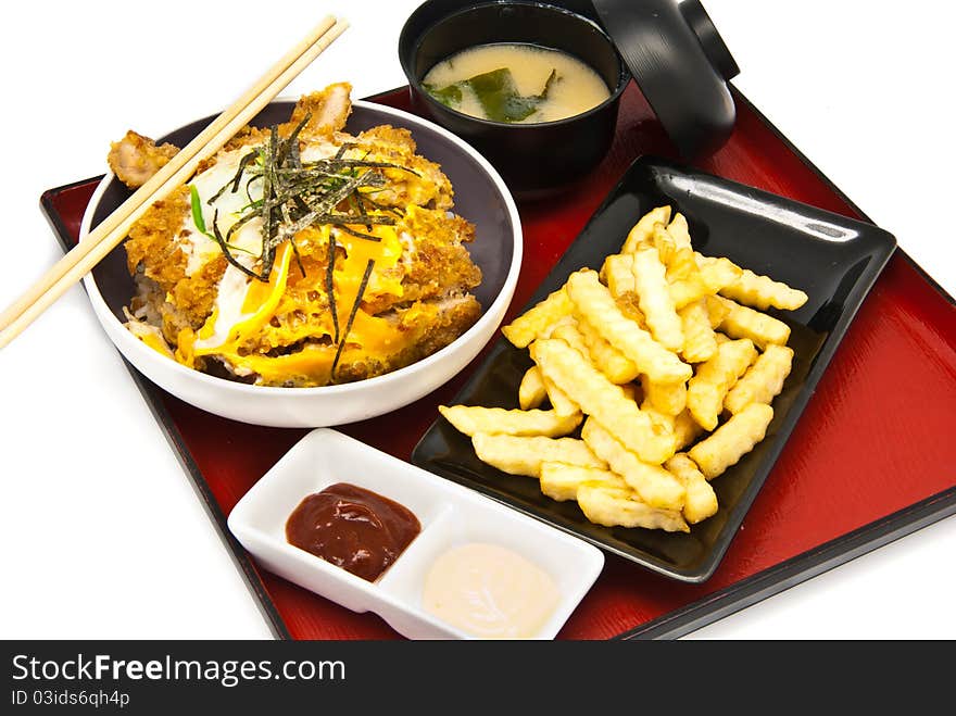 Bento, Japanese food style , fried chicken and  rice and soup and French fries on white background