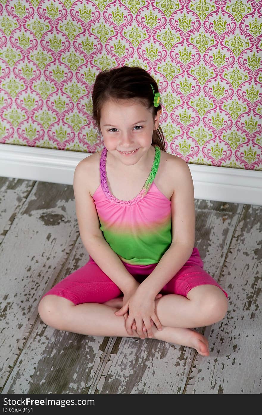 Cute girl sitting on the old-fashion floor. Cute girl sitting on the old-fashion floor