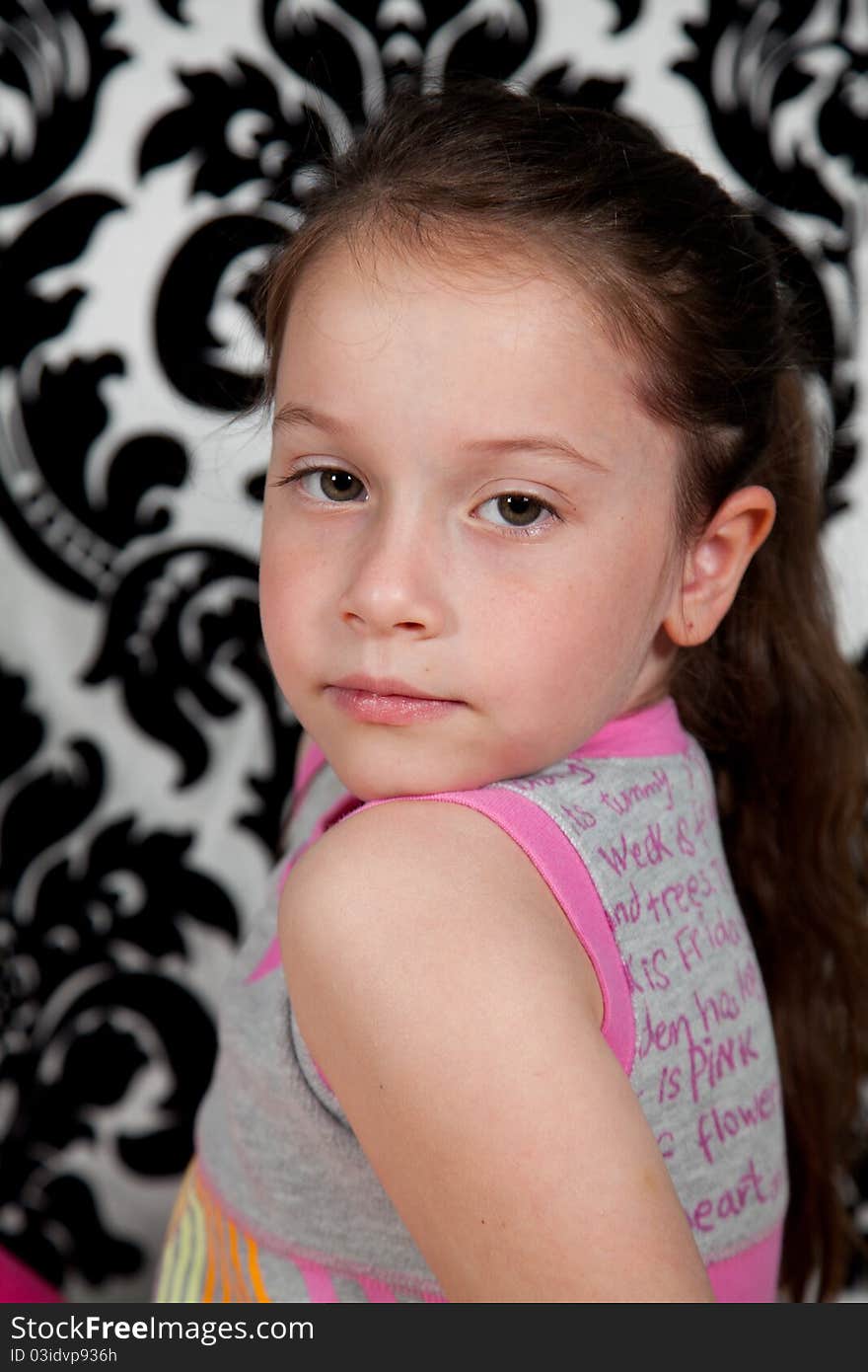 Portrait of cute girl over the black & white background