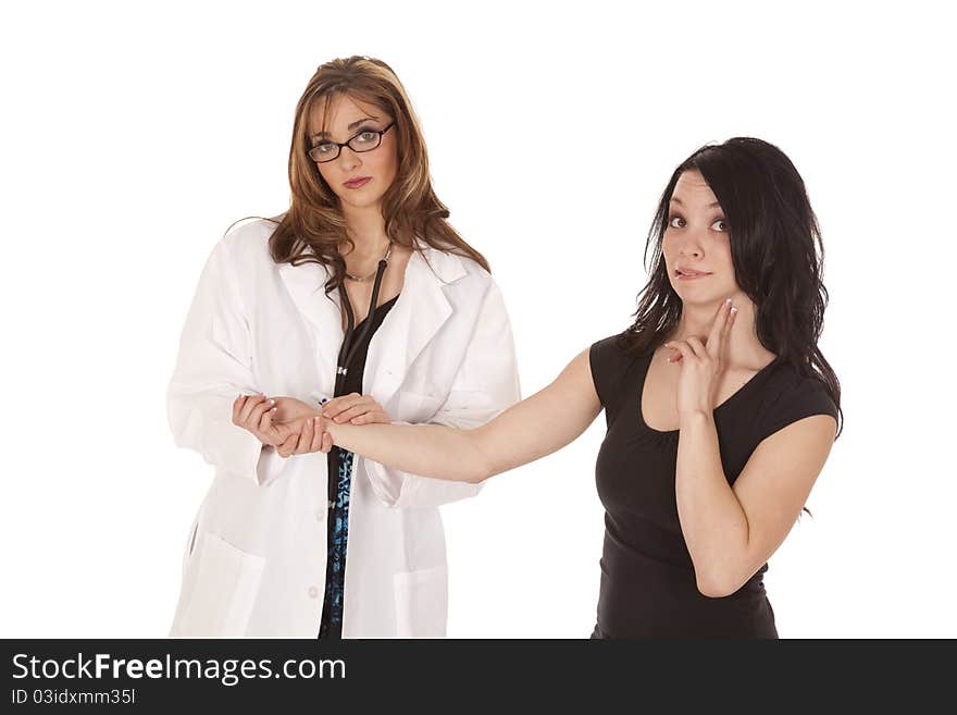 A women Doctor checking her patients pulse while her women patient is checking her own pulse. A women Doctor checking her patients pulse while her women patient is checking her own pulse.