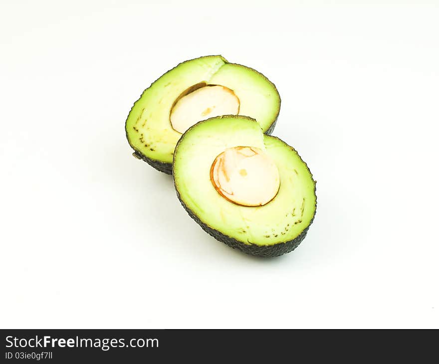 A sliced avocado in white background. A sliced avocado in white background