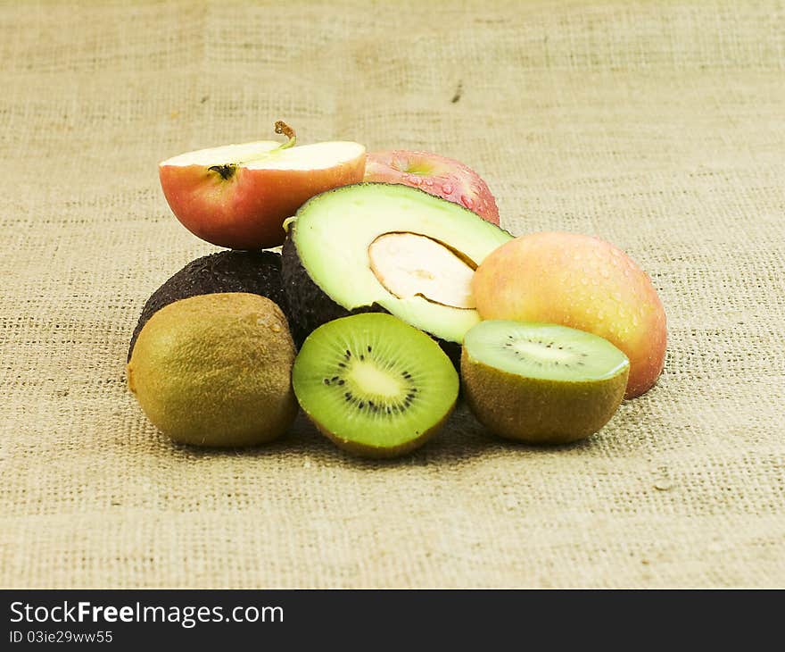 Organic sliced mixed fruit on dark background. Organic sliced mixed fruit on dark background