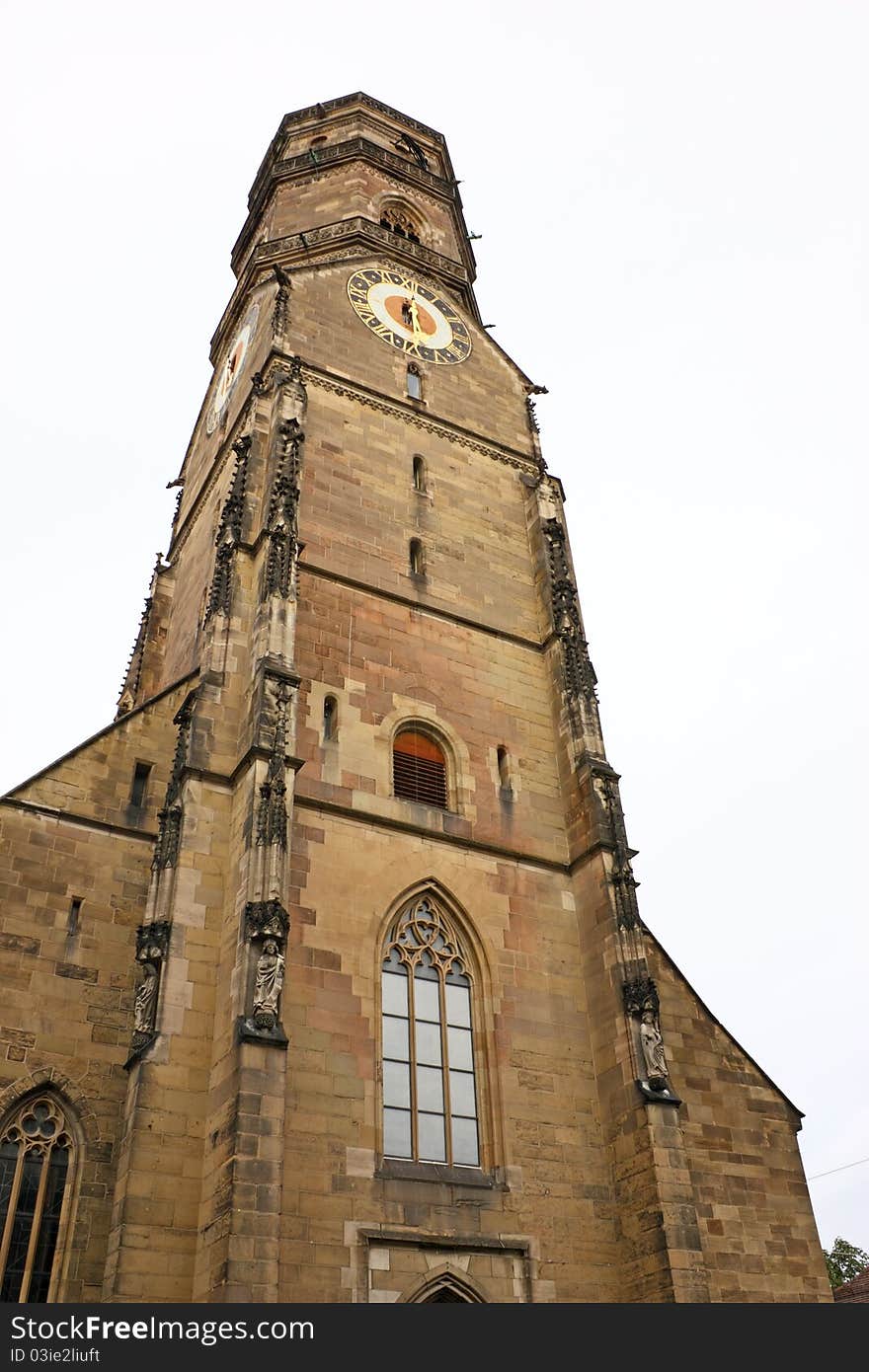 Tower in Gothic style  of Stiftskirche church in Stuttgart, Germany, destroyed by the bombing raids 1944, restored in the 1950s but not in all details. Tower in Gothic style  of Stiftskirche church in Stuttgart, Germany, destroyed by the bombing raids 1944, restored in the 1950s but not in all details