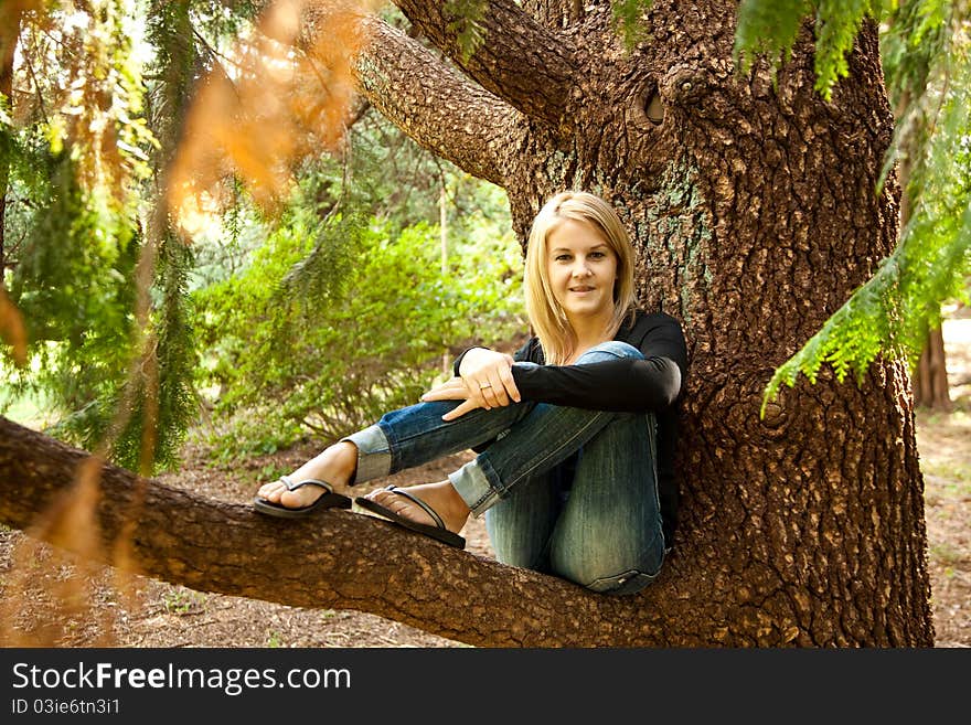 Portrait of smiling woman resting in the park