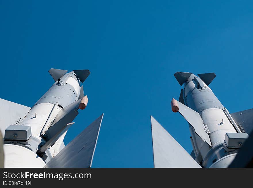 Two missiles against a background of blue sky