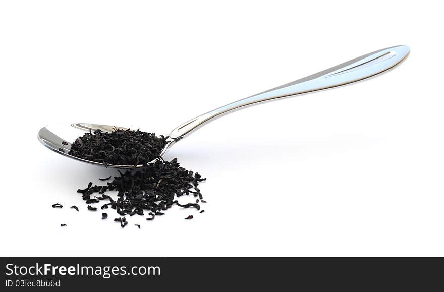 Black tea in a metal spoon