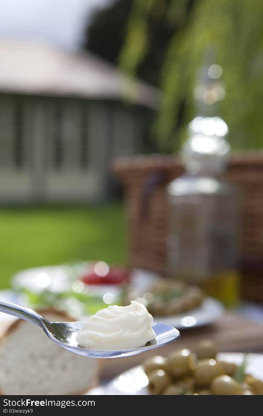 Mayo and fries presented as a snack on a striped blue table cloth. Mayo and fries presented as a snack on a striped blue table cloth