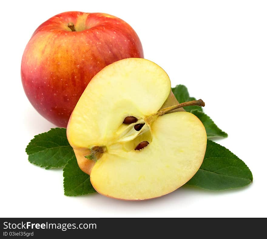 Juicy red apples with leaves on a white background