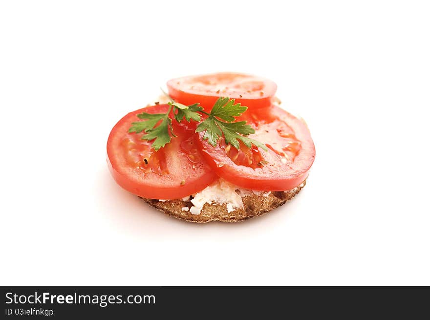 Crispbread and tomato isolated on white background