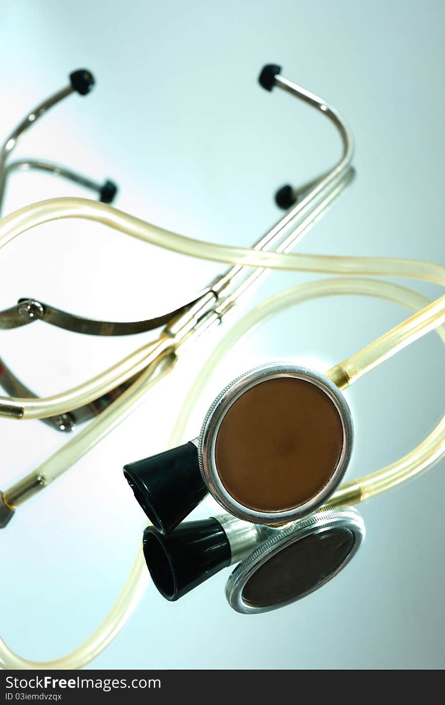 Stethoscope on a glass with reflection