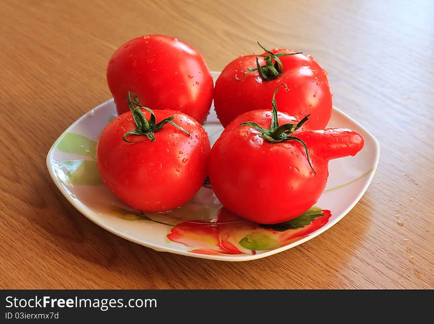 Red tomatoes a plate