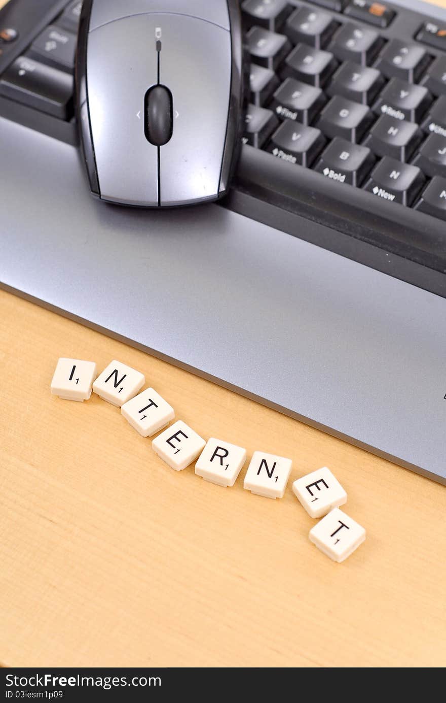 Word Tiles Spelling Out Internet Next To Keyboard