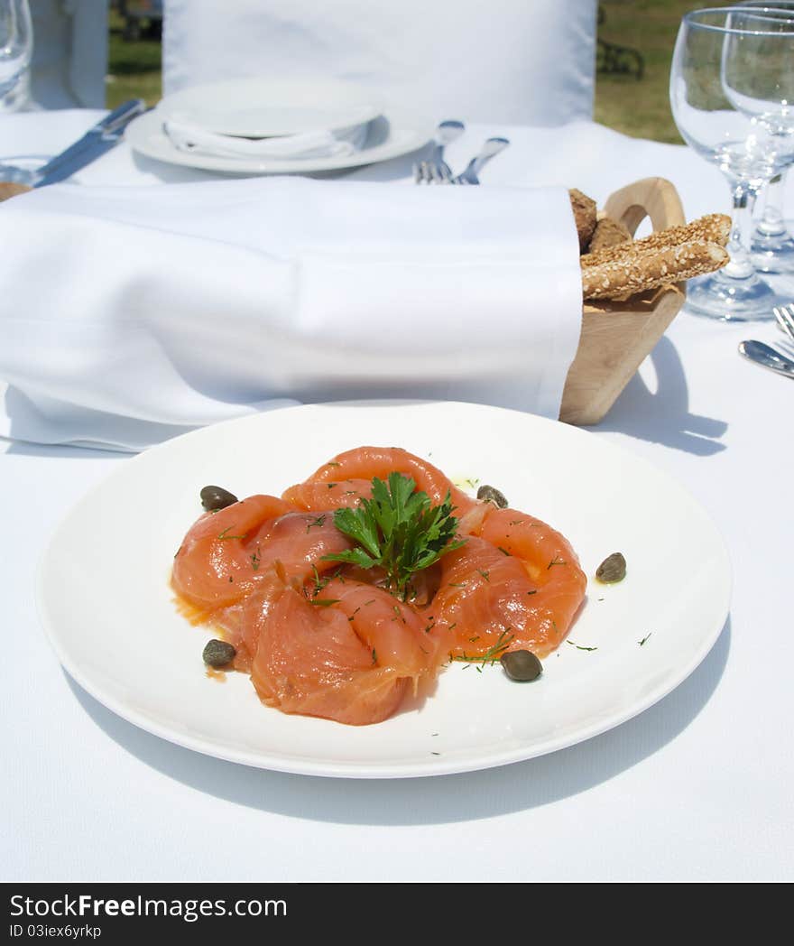 Gourme lunch with salmon in luxury mediterranean restaurant