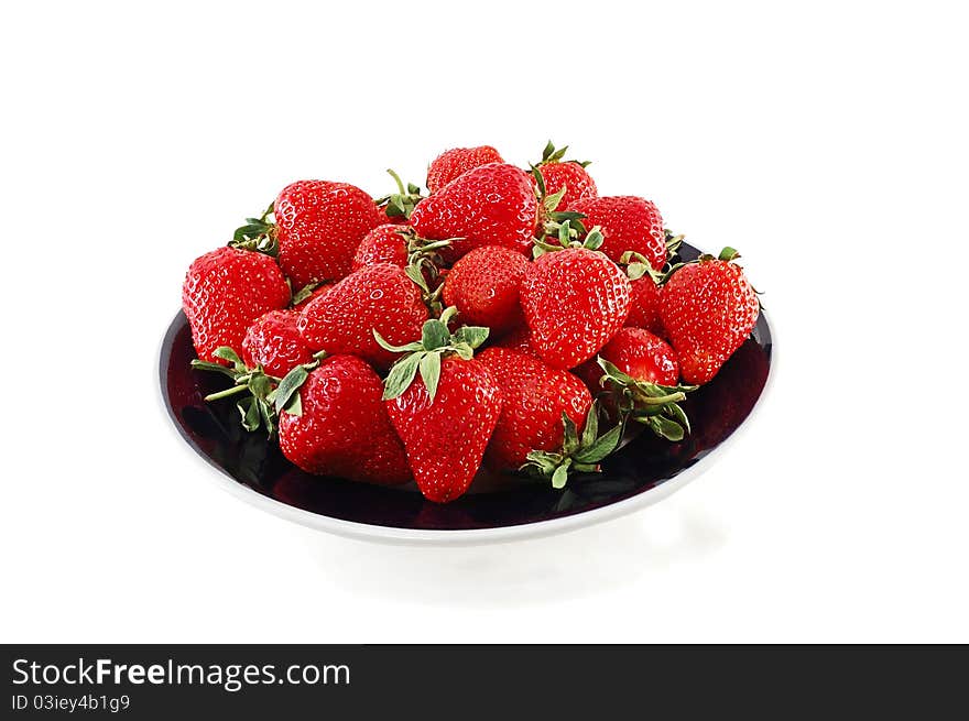 Tasty strawberry on a plate isolated on a white background