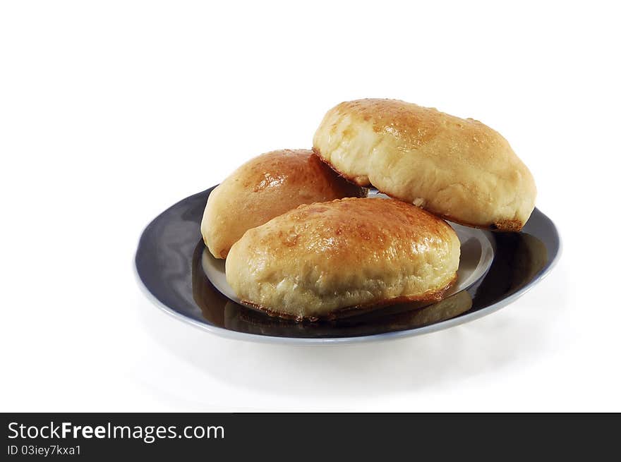 Fresh patties on a plate isolated on white background