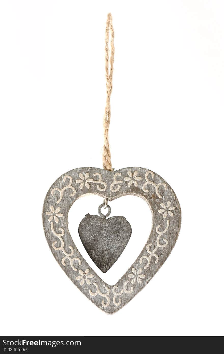 Beautiful wooden heart ornament hanging from a rope. Beautiful wooden heart ornament hanging from a rope