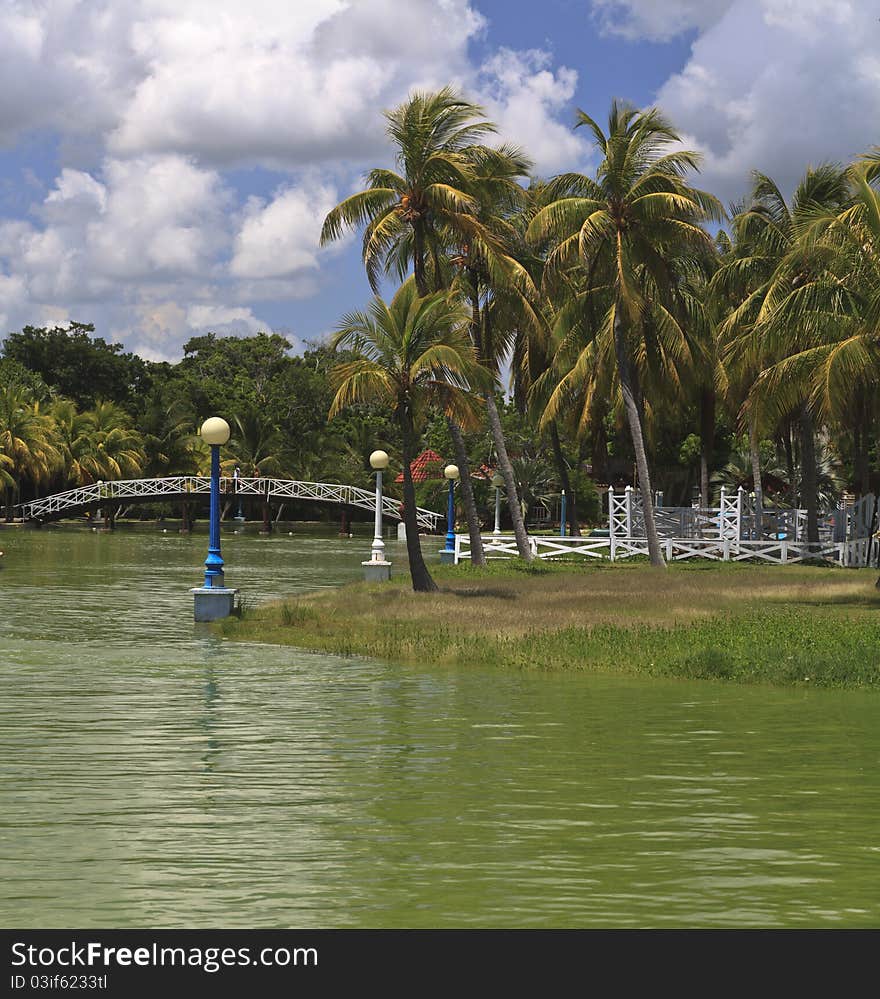 Islet with palms and street lanterns