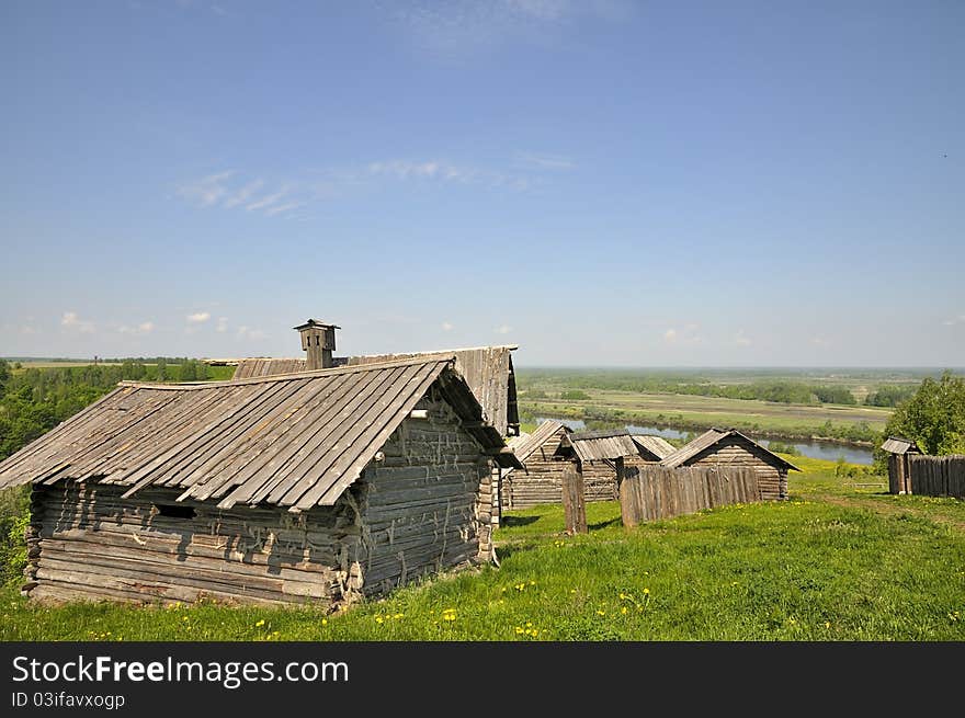 Russian village. The old traditional village on the riverbank. The village is on a high hill.