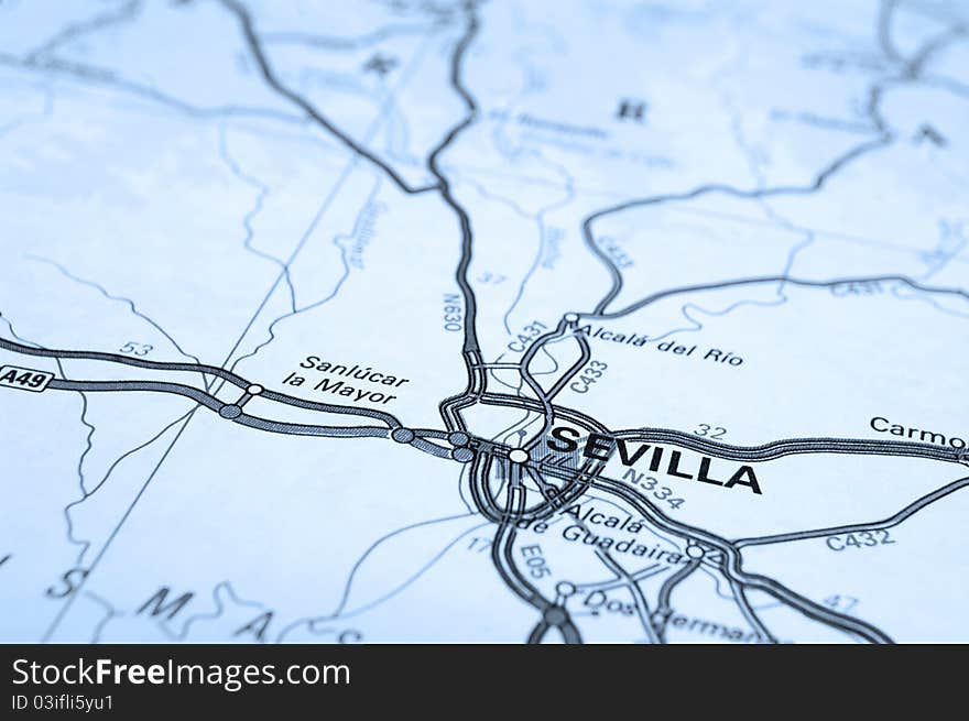 Macro of map showing Seville, Spain. Differential focus with shallow depth of field. Cool filter applied post production. Macro of map showing Seville, Spain. Differential focus with shallow depth of field. Cool filter applied post production.