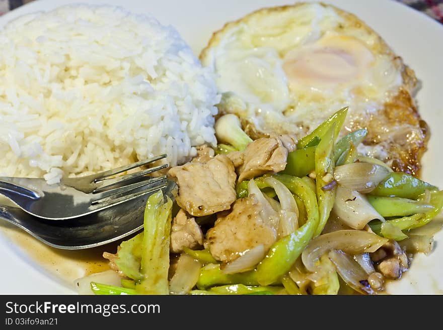 Fried pork with green chili and rice famous Thai food