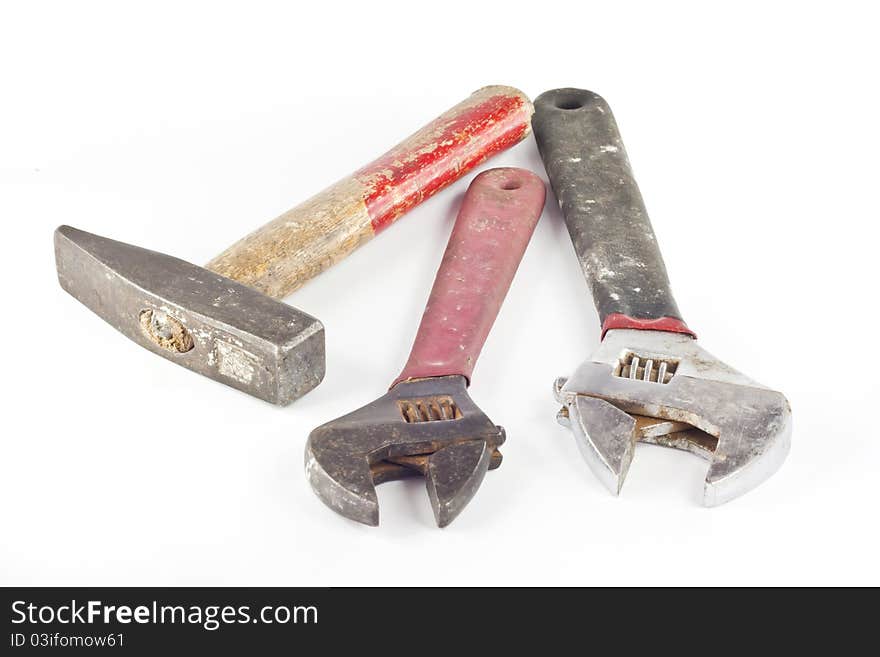 Old locker wrences and old hammer isolated on white background. Old locker wrences and old hammer isolated on white background