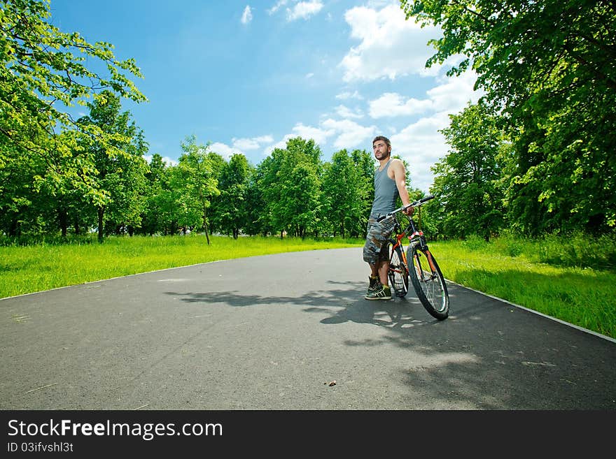 Young man cyclist sitting on bicycle