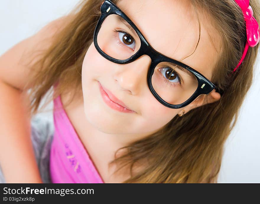 Portrait of a pretty little girl over white