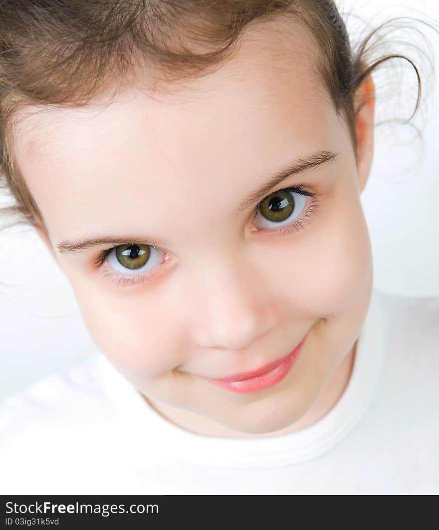 Portrait of a pretty little girl over white