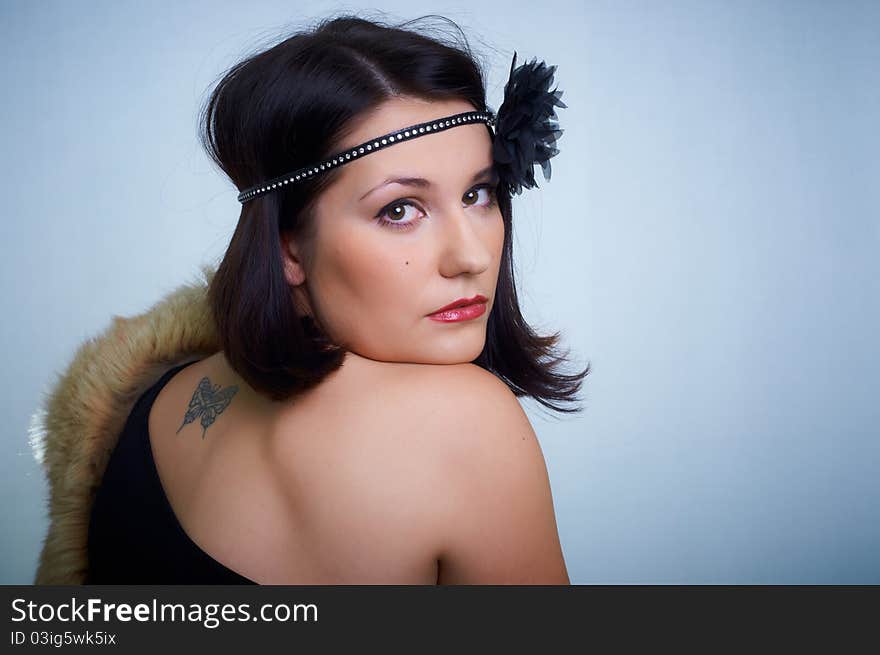 Retro portrait of a young woman in studio