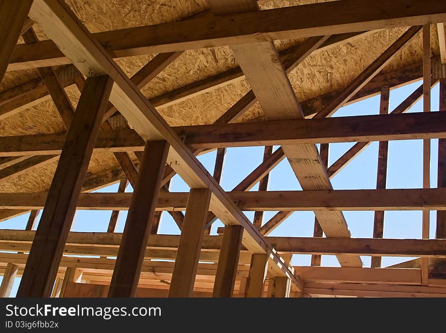 Roof is under construction from the interior of the house. Roof is under construction from the interior of the house.