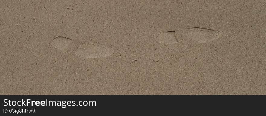 Shoe prints on smooth sand. Shoe prints on smooth sand