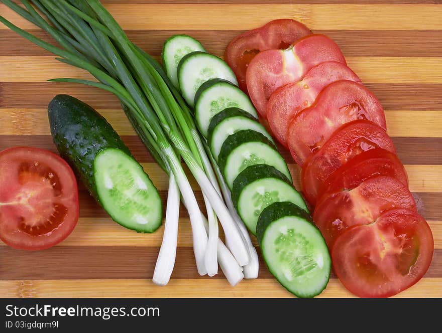 Sliced tomato, cucumber and onion. Sliced tomato, cucumber and onion