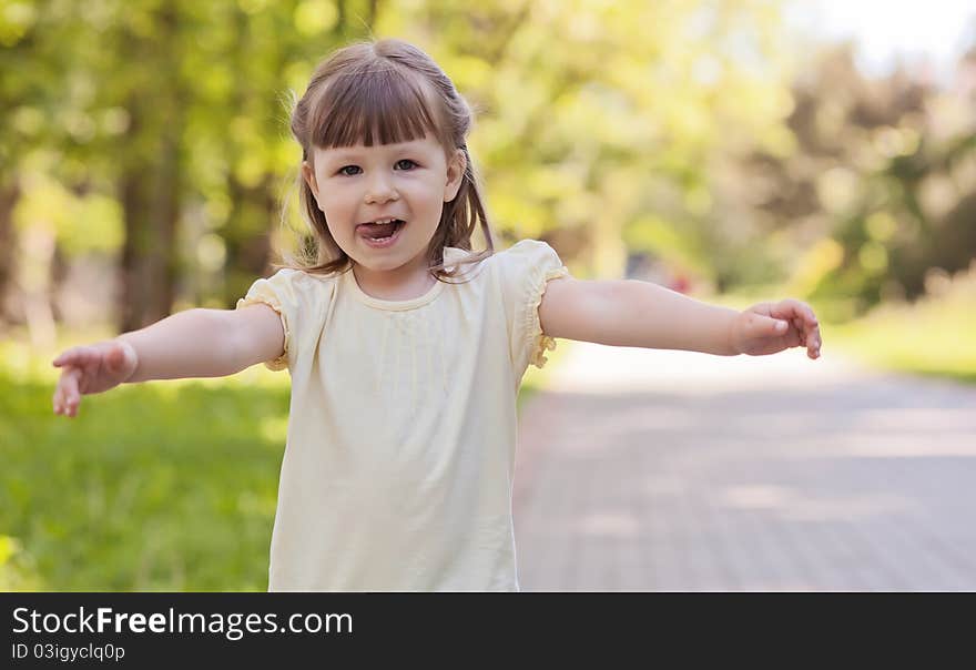 Small funny girl at the summer park. Small funny girl at the summer park