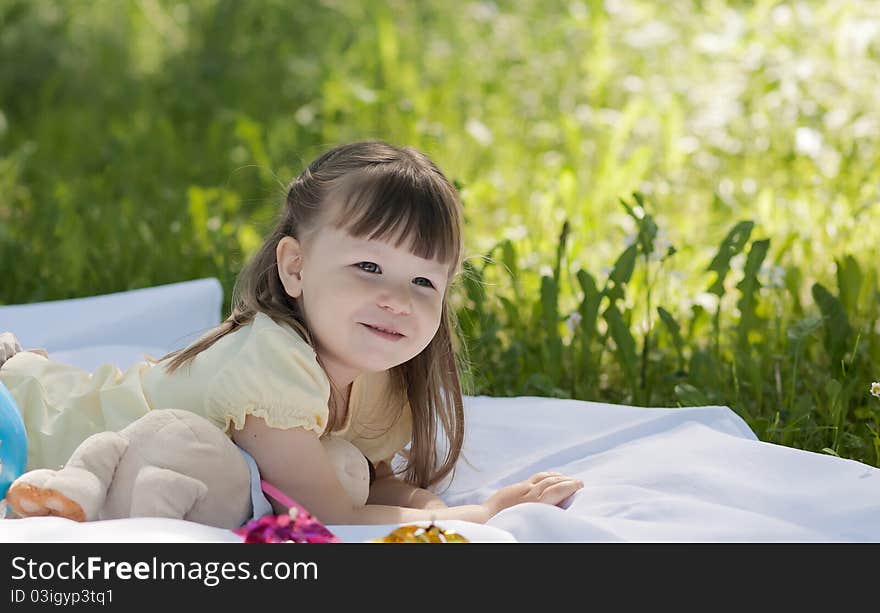 Small funny girl at the summer park. Small funny girl at the summer park