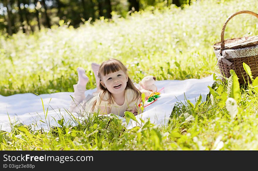 Small funny girl at the summer park. Small funny girl at the summer park