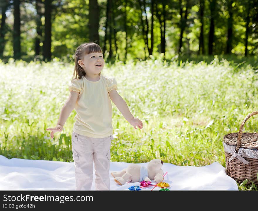 Small funny girl at the summer park. Small funny girl at the summer park