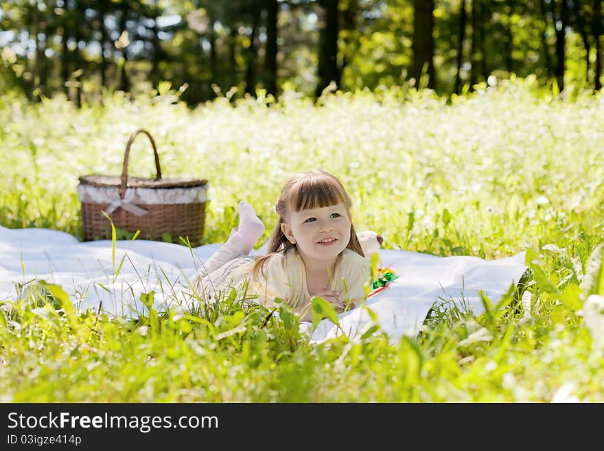 Small funny girl at the summer park. Small funny girl at the summer park