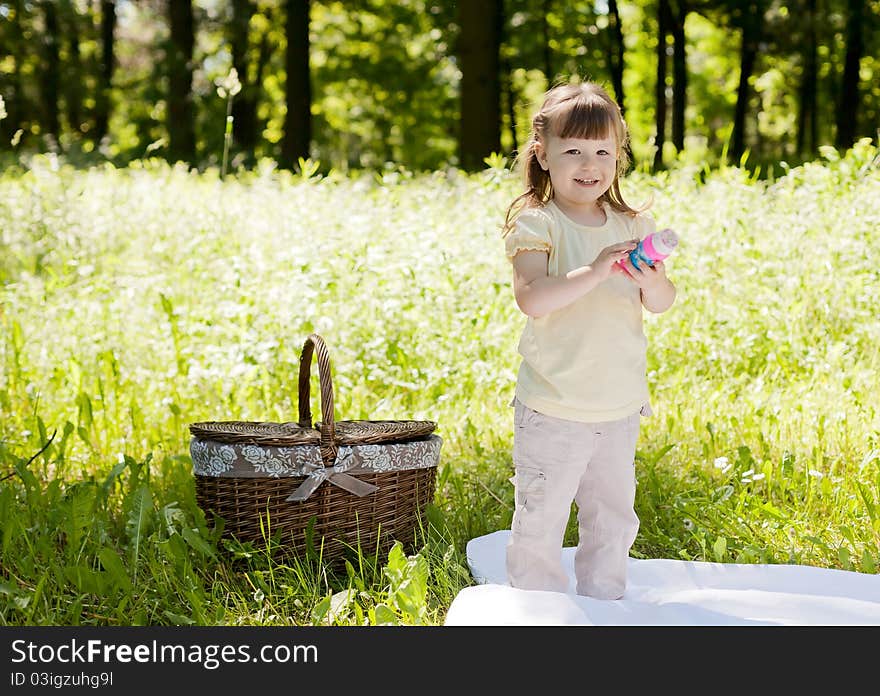 Small funny girl at the summer park. Small funny girl at the summer park