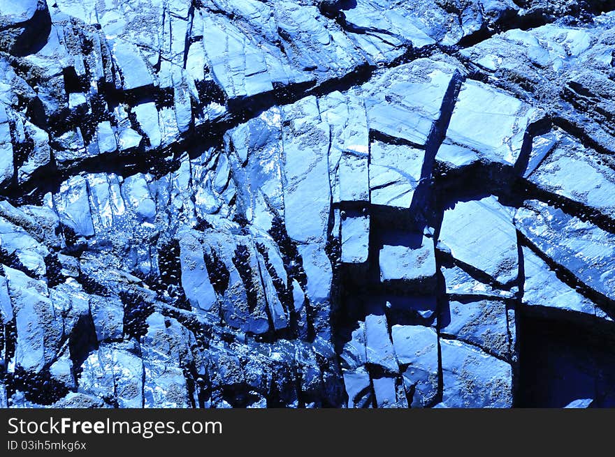 Abstract background shot of a rock face with interesting geological formations. Abstract background shot of a rock face with interesting geological formations