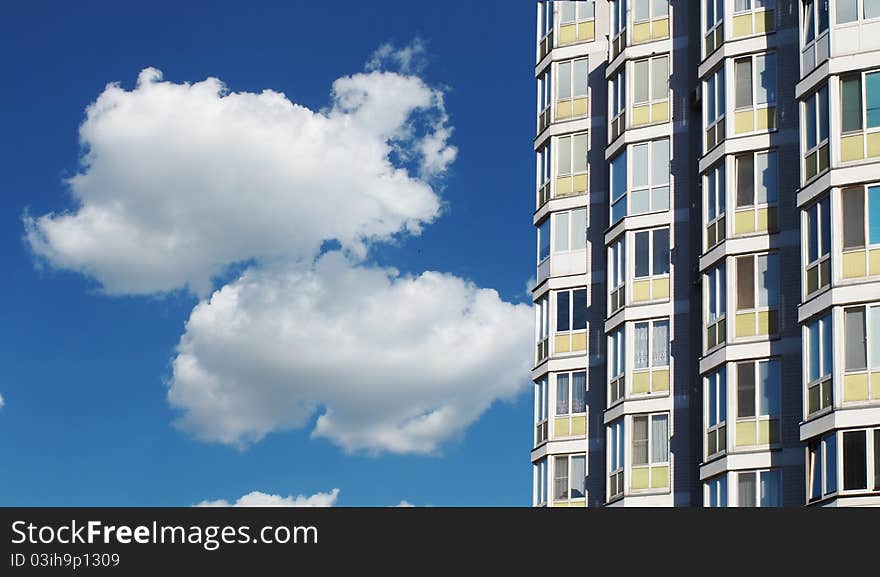 Two dwellings house in town on a background blue sky. Two dwellings house in town on a background blue sky