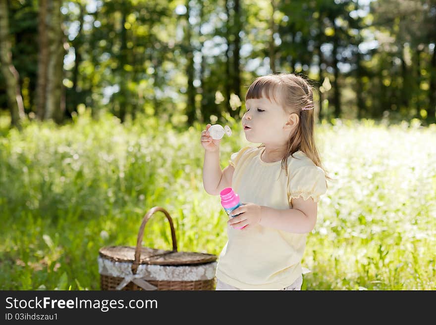 Small funny girl at the summer park. Small funny girl at the summer park