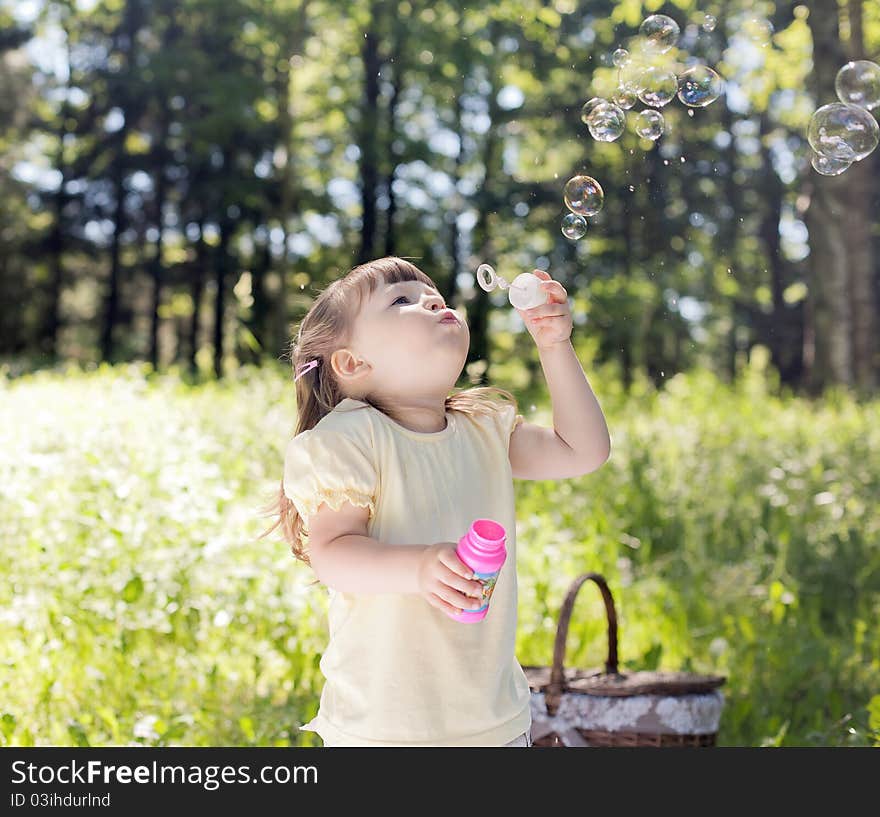 Small funny girl at the summer park. Small funny girl at the summer park