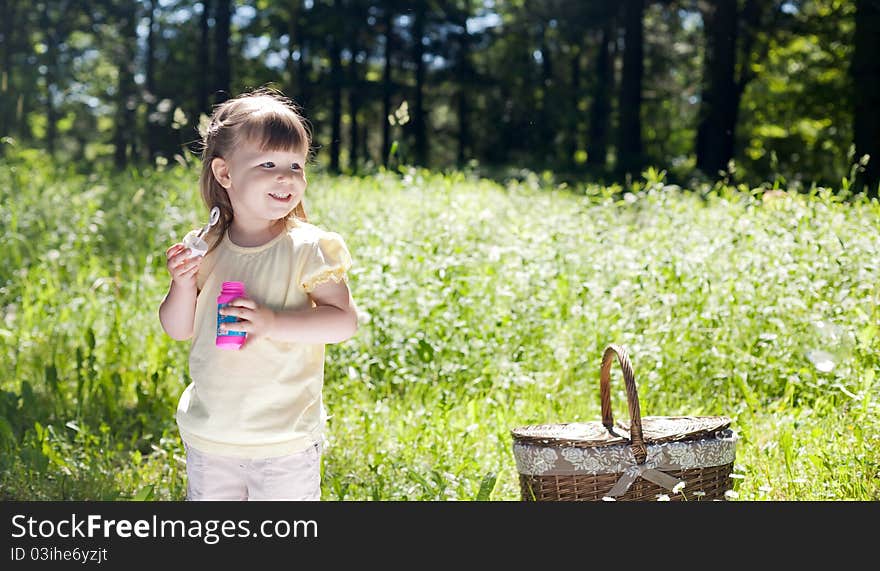 Small funny girl at the summer park. Small funny girl at the summer park