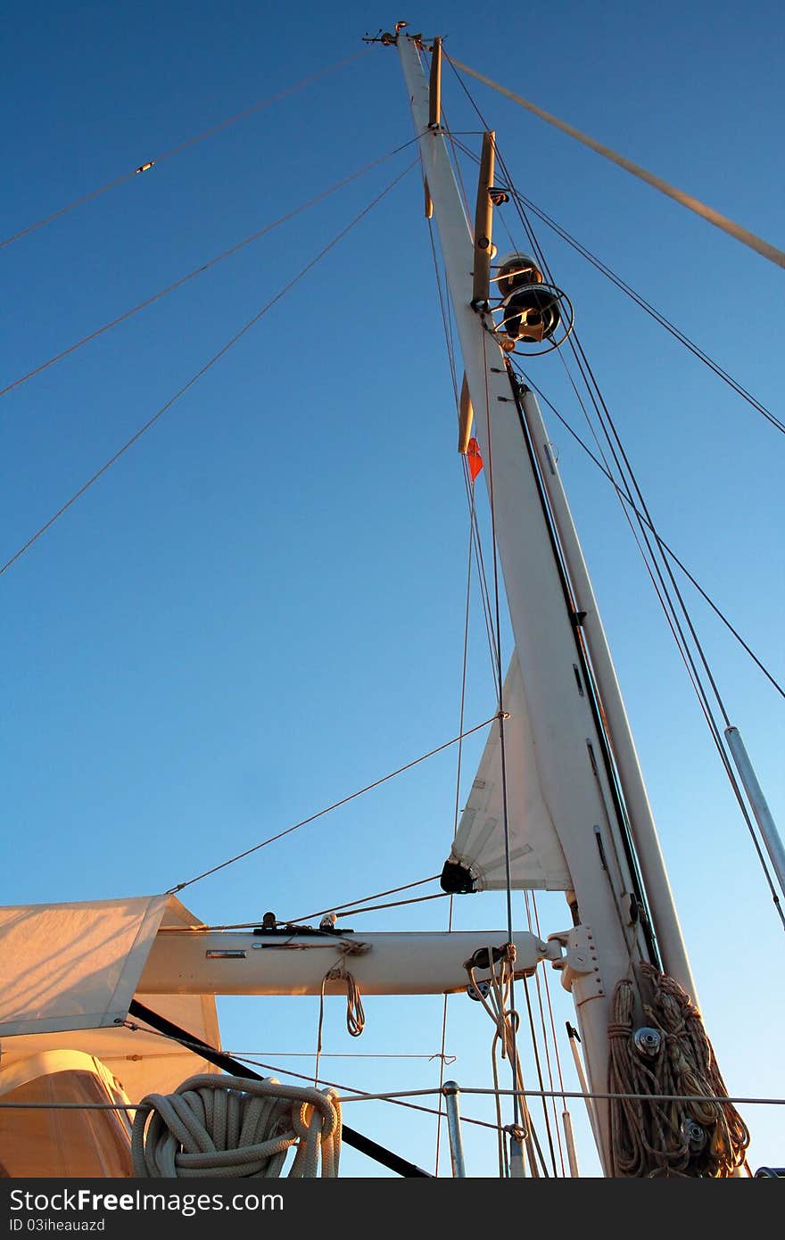 View of a sailing boat's must under the Greek blue sky